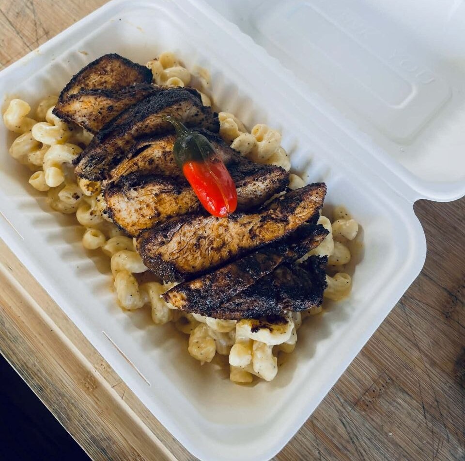 Cajun blackened chicken over mac and cheese