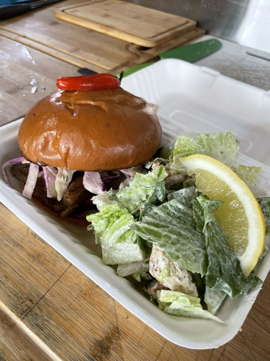 Pulled pork sandwich with caesar salad
